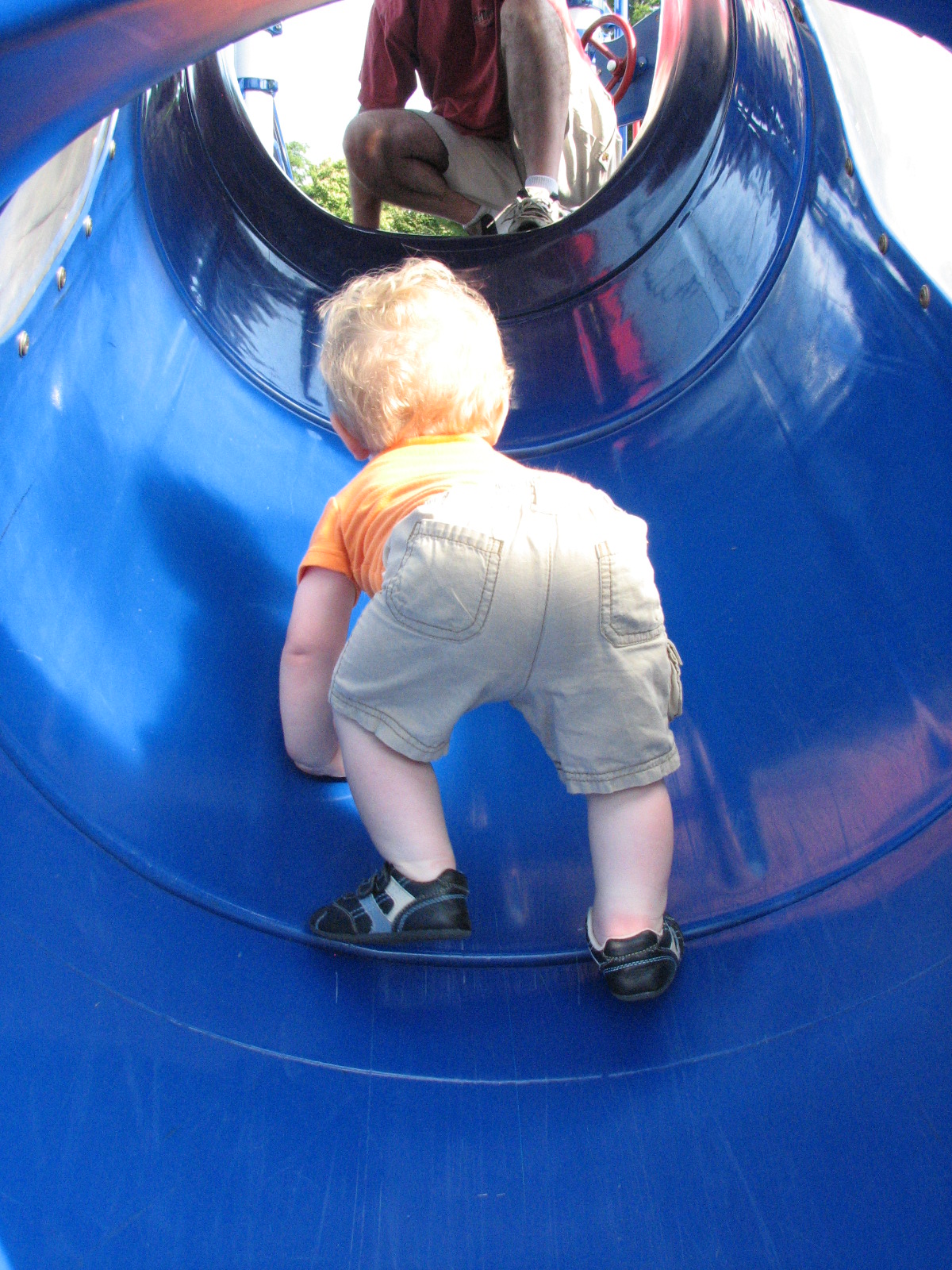 Going back for more (he really did climb the whole slide by himself!)